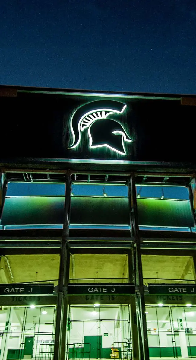 front of football stadium at night