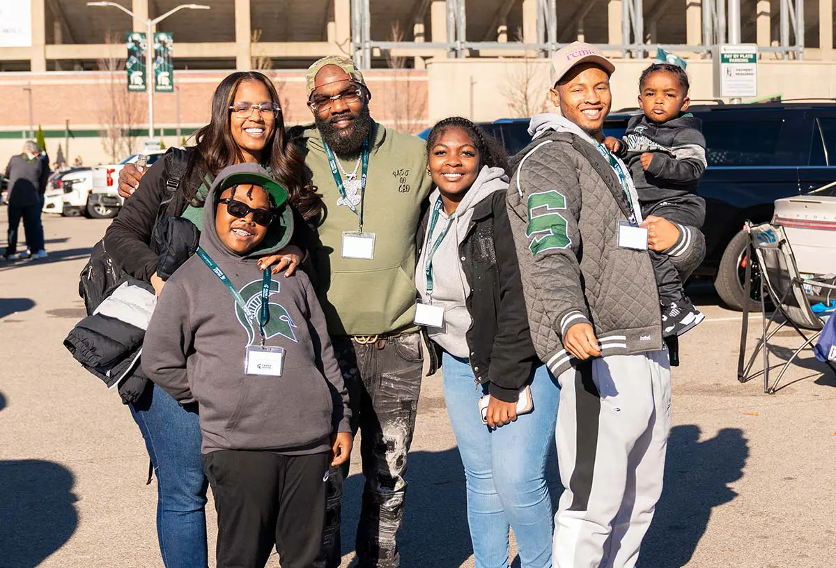Men, women, and children smiling