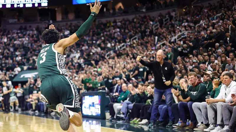 Basketball player with arms up